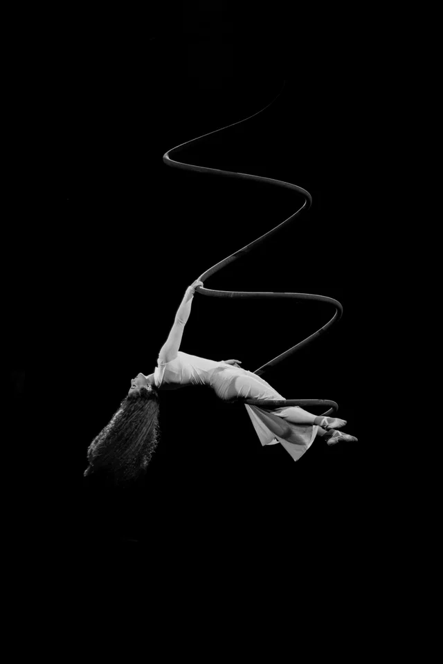 Black and white portrait of an aerial performer